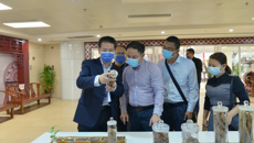 海口市中医医院院长胡建东率队到附属国际壮医医院参观调研
